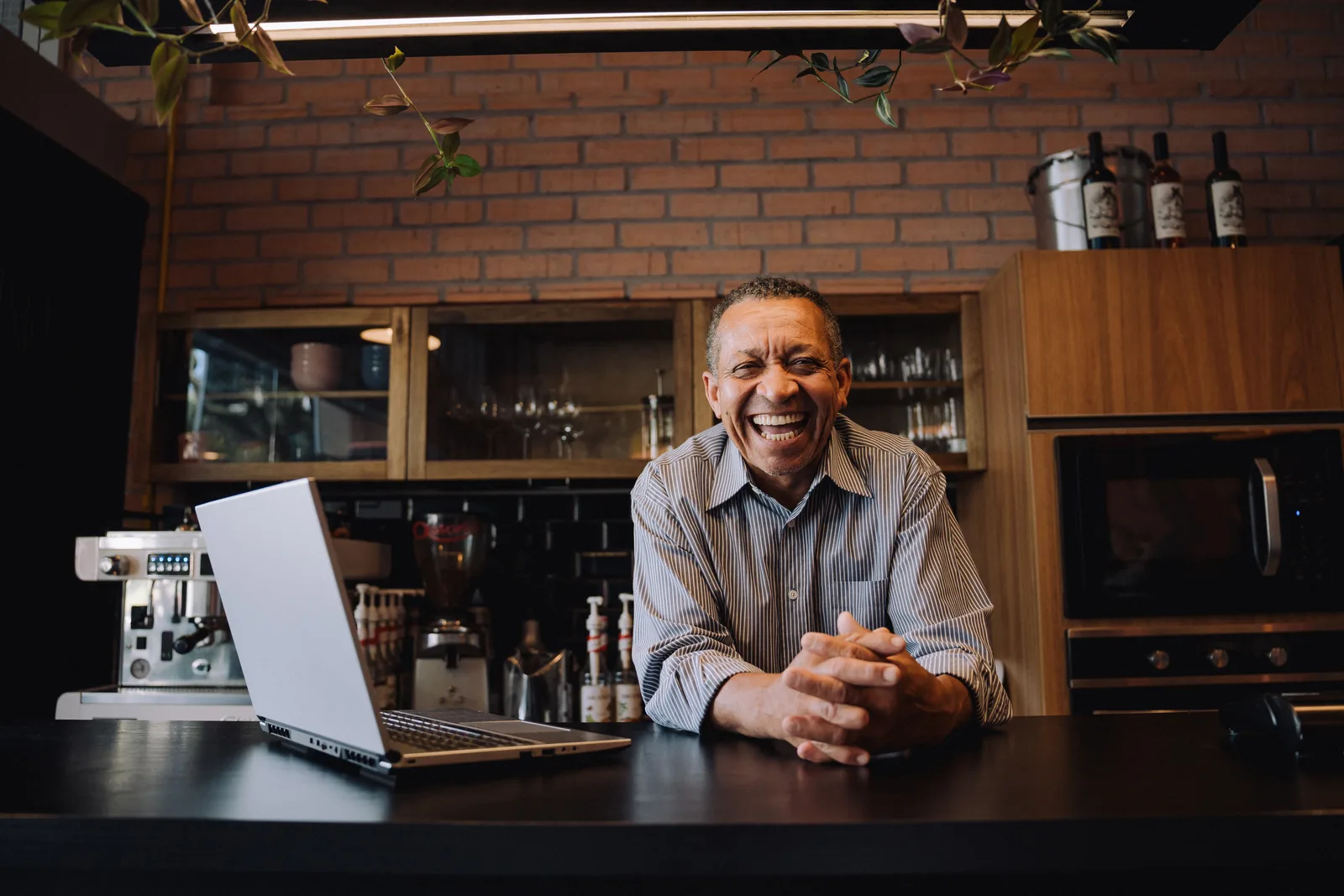 Coffee shop owner standing at their counter
